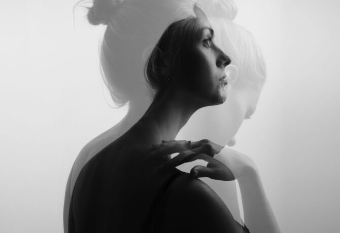 Creative double exposure portrait of a beautiful woman, monochro