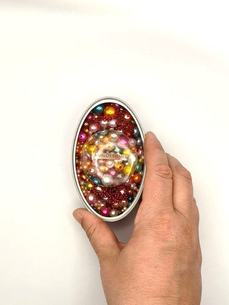 Boca de pato — shown in hand for scale